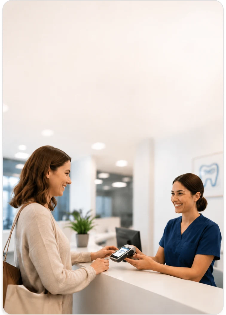 Patient making an in-person payment at a dental front desk